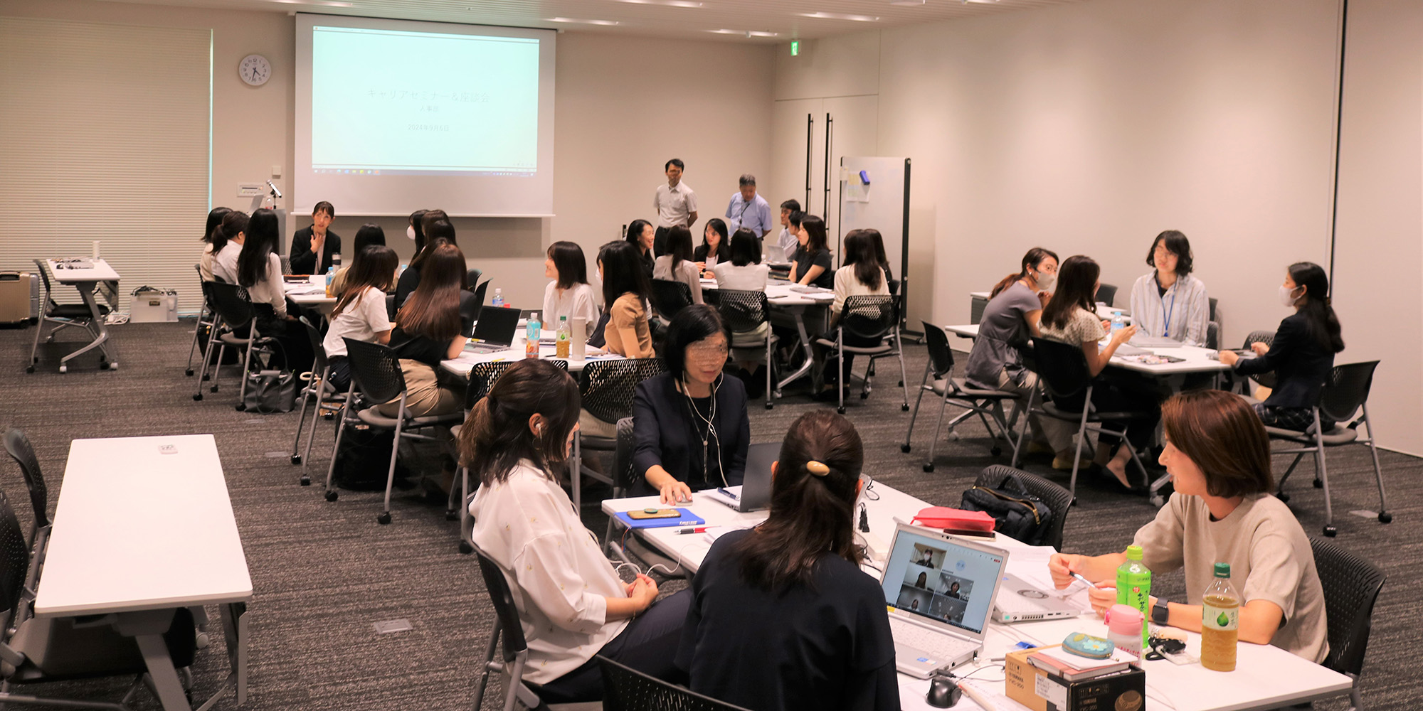 Holding a career advancement seminar for female employees